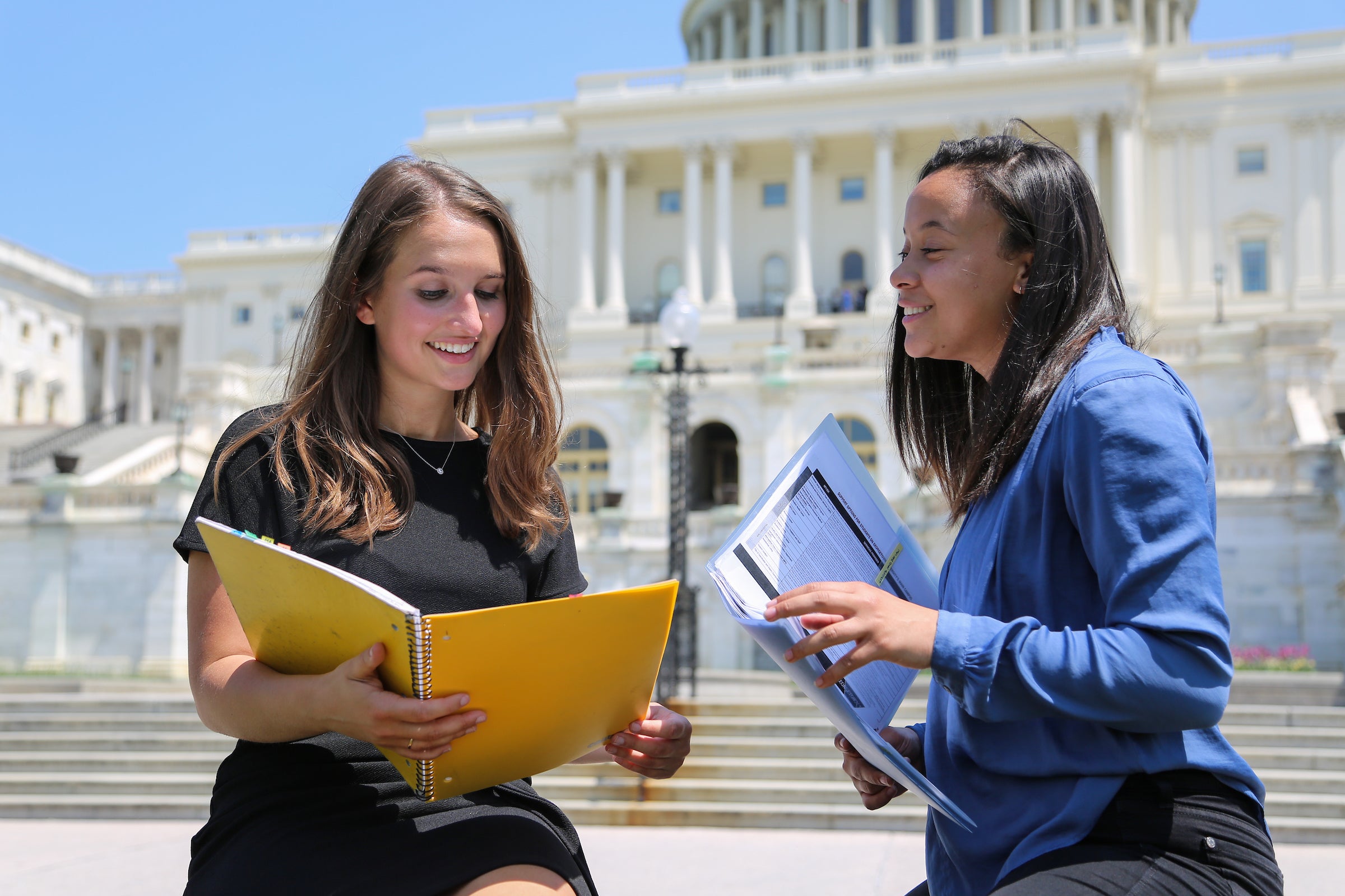 Two students standing in front of US Capitol
