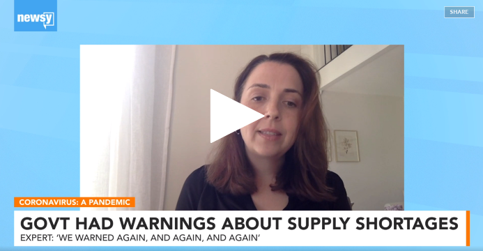 Ellen Carlin speaks with Newsy, text on bottom of images says "Coronavirus: A Pandemic; Govt had warnings about supply shortages. Expert: we warned again, and again, and again"